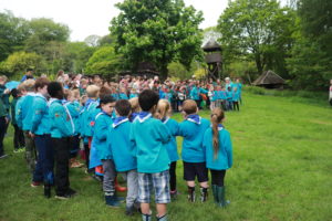 Beavers, Cubs and Scouts at closing ceremony on District camp